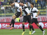 Marco Parolo of Parma FC celebrates with his team-mates Alessandro Lucarelli after scoring the opening goal during the Serie A match between Parma FC and AC Milan at Stadio Ennio Tardini on October 27, 2013
