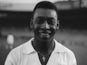 Pele, when playing for Santos, smiles at the camera ahead of a friendly match on June 13, 1965