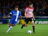 Nathaniel Knight-Percival of Peterborough in action with Conor Coady of Sheffield United during the Sky Bet League One match between Peterborough United and Sheffield United at London Road Stadium on October 22, 2013