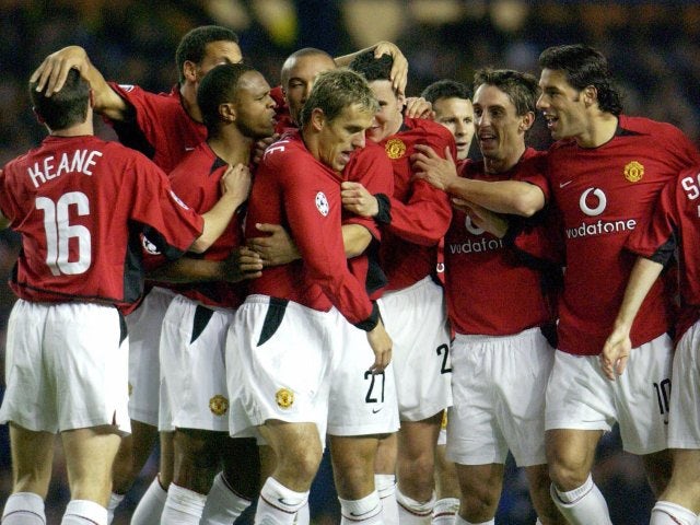 Manchester United players celebrate Phil Neville's goal against Rangers on October 22, 2003.