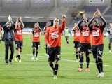 Renne's players celebrate after their victory 5-0 during the French L1 football match Toulouse vs Rennes on October 26, 2013 