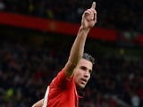 Manchester United's Dutch forward Robin van Persie celebrates scoring his team's first goal during the English Premier League football match against Stoke City on October 26, 2013