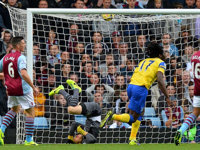 Everton's Belgian striker Romelu Lukaku scores the opening goal past Aston Villa's Brad Guzan during the English Premier League football match on October 26, 2013