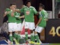 Saint Etienne's French midfielder Romain Hamouma is congratulated by his teammates after scoring a goal during the French L1 football match Saint-Etienne (ASSE) vs Paris (PSG) on October 27, 2013