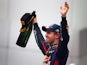 Sebastian Vettel of Germany and Red Bull celebrates winning the Indian Grand Prix and his fourth consecutive world title on October 27, 2013