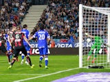 Bastia's French defender Sebastien Squillaci (hidden) scores a goal during the French L1 football match against Nice on October 26, 2013