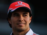 Sergio Perez of Mexico and McLaren walks in the paddock following practice for the Japanese Formula One Grand Prix at Suzuka Circuit on October 11, 2013