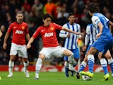 Manchester United's Japanese midfielder Shinji Kagawa vies with Real Sociedad's defender Carlos Martinez during the UEFA Champions League football match on October 23, 2013