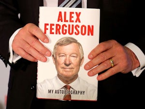 Ferguson signs copy of book for Muamba