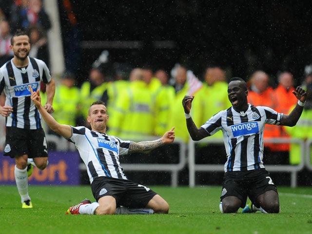 Newcastle player Mathieu Debuchy celebrates his goal uring the Barclays Premier League match between Sunderland and Newcastle United at Stadium of Light on October 27, 2013
