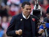 Sunderland's Uruguayan manager Gus Poyet celebrates at the final whistle of the English Premier League football match between Sunderland and Newcastle United at The Stadium of Light in Sunderland, northeast England on October 27, 2013