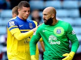 Goalkeeper Tim Howard of Everton is congratulated by team mate Ross Barkley after saving a penalty during the Barclays Premier League match against Aston Villa on October 26, 2013