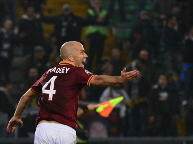 AS Roma's US midfielder Michael Bradley celebrates after scoring during the Serie A football match Udinese vs AS Roma at 'Stadio Friuli' in Udine on October 27, 2013