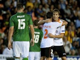Valencia's midfielder Sergio Canales celebrates his goal with teammates during the UEFA Europa league Group A football match Valencia FC vs FC St. Gallen at the Mestalla stadium in Valencia on October 24, 2013