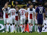 Paris Saint-Germain's Swedish forward Zlatan Ibrahimovic celebrates with teammates after scoring his team's first goal during the UEFA Champions League group C football match against Anderlecht on October 23, 2013