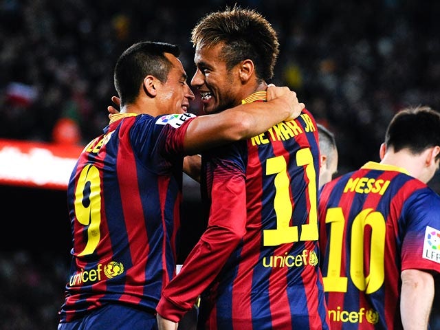 Barcelona's Alexis Sanchez celebrates with teammate Neymar after scoring the opening goal against Espanyol on November 1, 2013