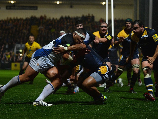 Bath's Anthony Perenise powers his way through the Worcester Warriors players to score a try on November 11, 2013
