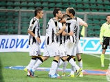 Udinese's Antonio Di Nataleis congratulated by team mates after scoring the opening goal via the penalty spot against US Sassuolo Calcio on October 30, 2013