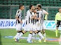 Udinese's Antonio Di Nataleis congratulated by team mates after scoring the opening goal via the penalty spot against US Sassuolo Calcio on October 30, 2013