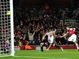 Arsenal's Spanish midfielder Santi Cazorla scores the opening goal during the English Premier League football match between Arsenal and Liverpool at the Emirates Stadium in north London, on November 2, 2013