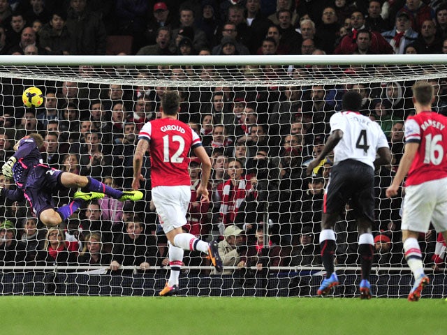 Arsenal's Welsh midfielder Aaron Ramsey scores his team's second goal during the English Premier League football match between Arsenal and Liverpool at the Emirates Stadium in north London, on November 2, 2013