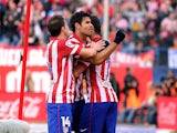 Diego Costa of Club Atletico de Madrid celebrates after scoring his team's 2nd goal during the La Liga match between Club Atletico de Madrid and Athletic Club at Vicente Calderon stadium on November 3, 2013