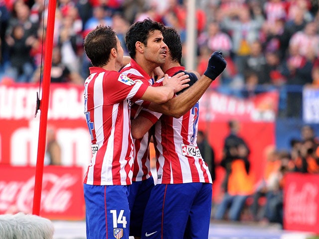 Diego Costa of Club Atletico de Madrid celebrates after scoring his team's 2nd goal during the La Liga match between Club Atletico de Madrid and Athletic Club at Vicente Calderon stadium on November 3, 2013