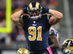 Chris Long of the St. Louis Rams celebrates after sacking Blaine Gabbert of the Jacksonville Jaguars at the Edward Jones Dome on October 6, 2013