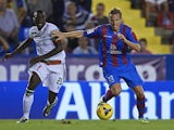 Christian Lell of Levante competes for the ball with Pereira of Granada during the La Liga match between Levante UD and Granada CF on November 3, 2013