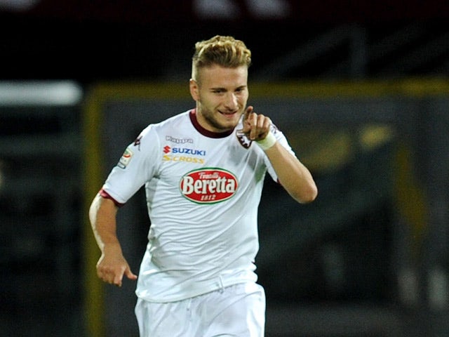 Torino s Ciro Immobile celebrates after scoring the opening goal