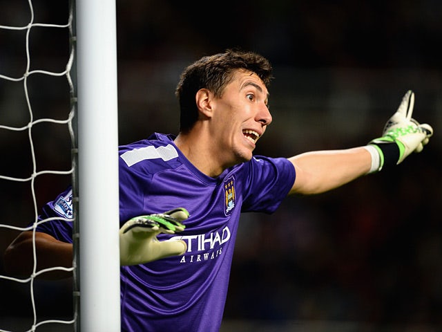 Man City goalkeeper Costel Pantilimon in action against Newcastle during their Capital One Cup Fourth Round match on October 30, 2013