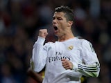 Real's Cristiano Ronaldo celebrates after scoring his team's third goal against Sevilla on October 30, 2013