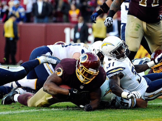 Darrel Young of the Washington Redskins scores the game-winning touchdown in overtime against the San Diego Chargers during an NFL game at FedExField on November 3, 2013