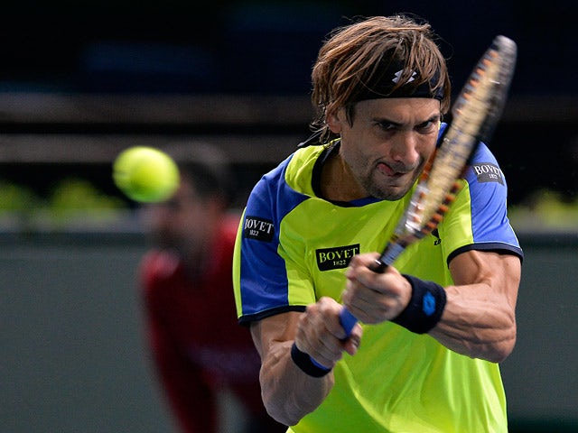 David Ferrer in action against Lukas Rosol during round two of the Paris Masters on October 30, 2013