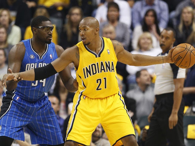 David West #21 of the Indiana Pacers handles the ball against Jason Maxiell #54 of the Orlando Magic during the game at Bankers Life Fieldhouse on October 29, 2013