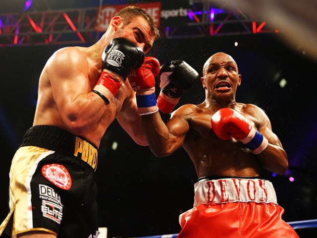 Devon Alexander punches Lee Purdy during their IBF Welterweight Title fight at Boardwalk Hall Arena on May 18, 2013