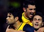 Atletico Madrid's Brazilian forward Diego Costa celebrates with his teammates after scoring on a penalty kick during the Spanish league football match against Granada on October 31, 2013