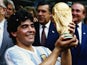 Diego Maradona of Argentina lifts the trophy and celebrates winning the FIFA World Cup final in Mexico City on June 29, 1986 