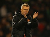 Manager David Moyes of Manchester United applauds the travellling fans at the final whislte during the Barclays Premier League match between Fulham and Manchester United at Craven Cottage on November 2, 2013