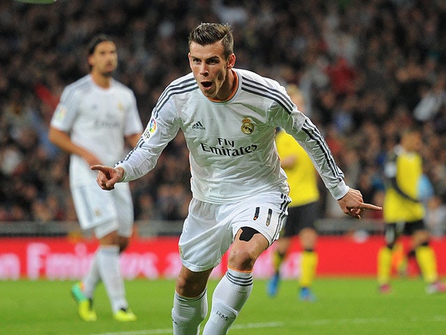 Real's Gareth Bale celebrates after scoring the opening goal against Sevilla on October 30, 2013