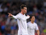 Real's Gareth Bale celebrates after scoring his team's second goal against Sevilla on October 30, 2013