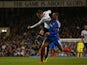Tottenham's Gylfi Sigurdsson beats Hull's Curtis Davies to score the opening goal in their Capital One Cup Fourth Round match on October 30, 2013
