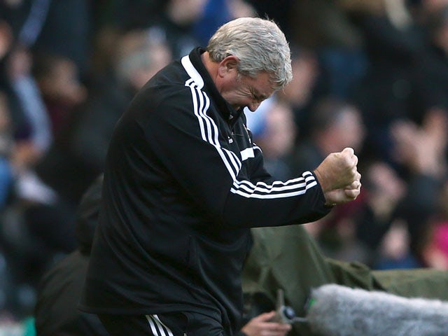 Hull manager Steve Bruce celebrates the own goal of Carlos Cuellar of Sunderland during the Barclays Premier League match between Hull City and Sunderland at KC Stadium on November 2, 2013