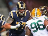 Jake Long #77 of the St. Louis Rams blocks during a preseason game against the Green Bay Packers at the Edward Jones Dome on August 17, 2013