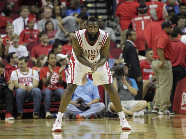 James Harden #13 of the Houston Rockets watches from the end of the court during a free throw opportunity against the Dallas Mavericks at Toyota Center on November 1, 2013