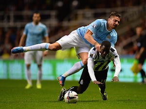 Extra-time goals see Man City through