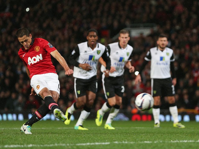Javier Hernandez of Manchester United scores from the penalty spot during the Capital One Cup fourth round match between against Norwich City on October 29, 2013