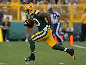 Jeremy Ross #10 of the Green Bay Packers returns a kick against the Arizona Cardinals at Lambeau Field on August 9, 2013