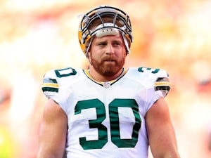 Fullback John Kuhn of the Green Bay Packers warms up prior to the preseason game against the Kansas City Chiefs at Arrowhead Stadium on August 29, 2013