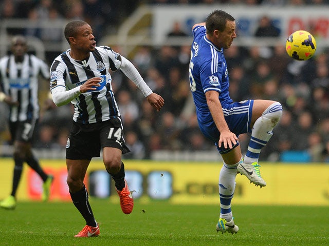 Chelsea's John Terry and Newcastle's Loic Remy battle for the ball on November 2, 2013
